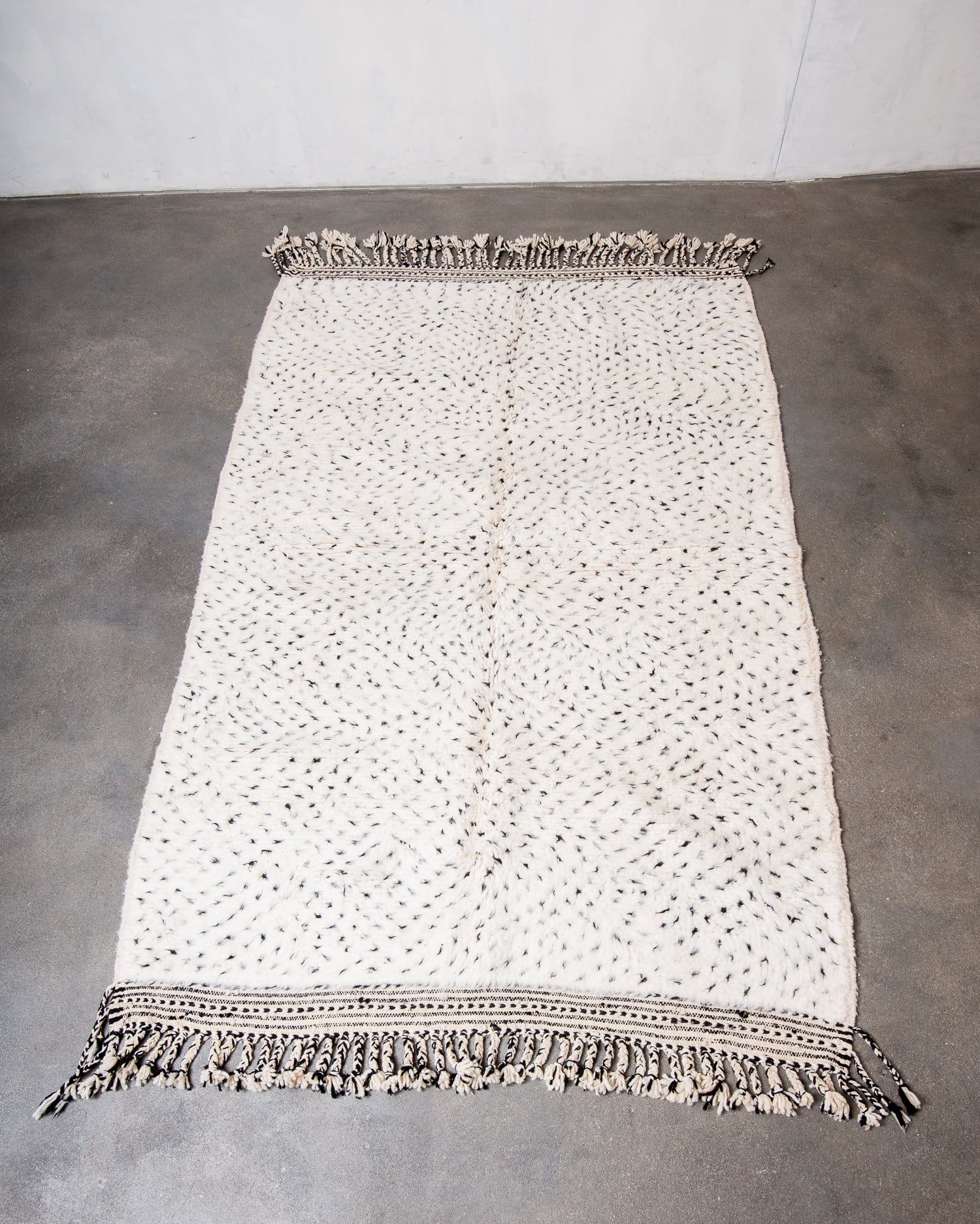Modern, designer, handcrafted Berber rug from Morocco. Beniourain carpet with minimalist design, natural wool pile and a fluffy texture.